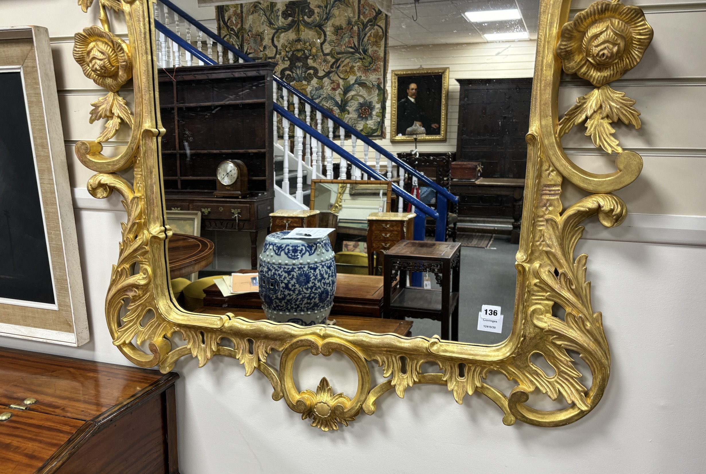 An 18th century style carved giltwood wall mirror, width 106cm, height 172cm